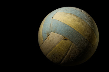 Old Volleyball on Black Background