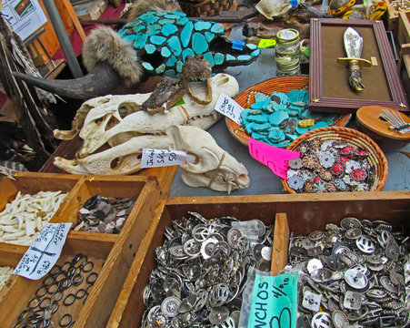 Flea Market in Texas. 
Traditional souvenirs in western Texas and Mexican vintage style - decorative metal things, jewelry made of turquoise stones, skulls with horns and a knife.