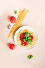 Spaghetti pasta on pink background