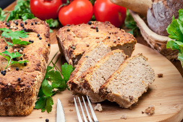 Traditional delicious meat pate with chicken liver on cutting board