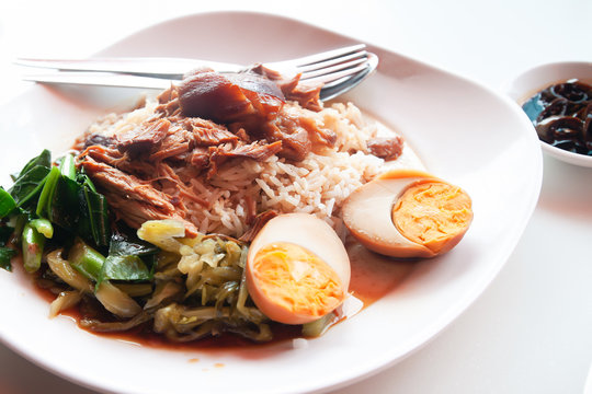 Stewed pork with rice and egg, Chinese-Thai traditional favorite food. Unhealthy food