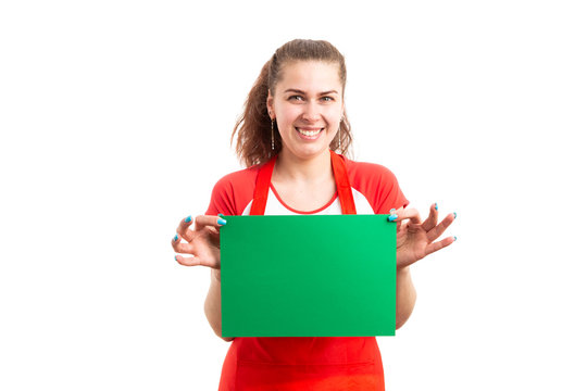  Female supermarket or retail worker holding empty green paper.