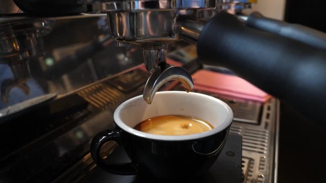 Making coffee cup on espresso machine in a cafe bistro
