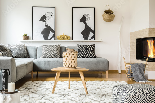 Wooden Table On Carpet In African Living Room Interior With