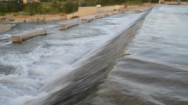 Footage of low head dam on the Secchia river near Sassuolo, Modena, 04 29 2018