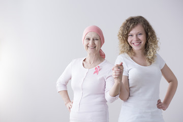 Mother and daughter holding hands