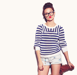 Portrait of young happy woman model with bright makeup and colorful lips in hipster summer clothes isolated on white. Going crazy