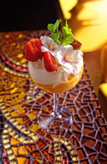 sweet mousse dessert with strawberries and cream