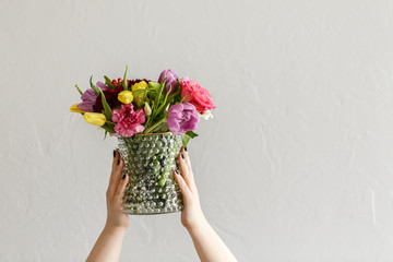 Person with colorful flowers
