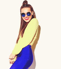 portrait of cheerful fashion smiling hipster girl going crazy in casual colorful yellow summer...