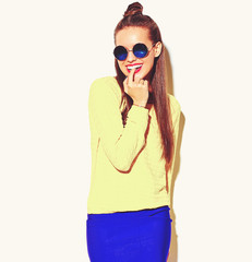 portrait of cheerful fashion smiling hipster girl going crazy in casual colorful yellow summer...
