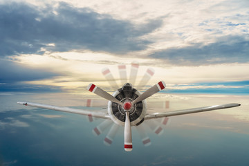 Old airplane on the blue sky	