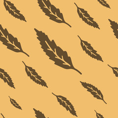 Vector illustration of brown leaves seamless pattern. Flat beige background. Modern mood and colors