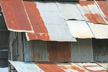 Wooden house with rusty zinc roof