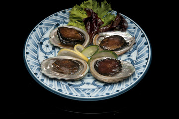 abalone on the shell on a japanese platter