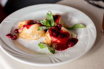 raspberry brownies. cakes with berries on a white plate. confectionery. candy