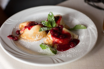 raspberry brownies. cakes with berries on a white plate. confectionery. candy