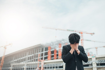 Businessmen stress at construction projects.