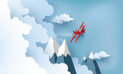 ilustracja samolotu nad chmurami i górami.