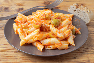 homemade stew of macaroni with tomato olive and pickle