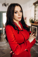 The stylish girl stands in the room