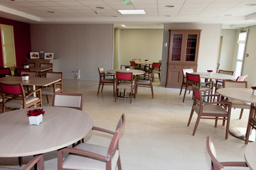 large restaurant room with tables and chairs
