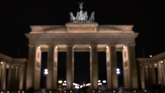 Rack focus 4K video clip of people at night by The Brandenburg Gate, Pariser Platz, Berlin, Germany