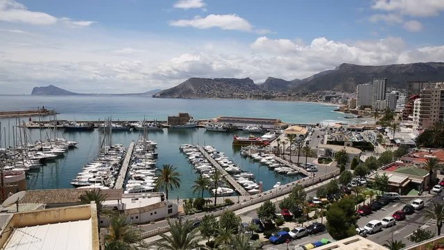 Calpe Spain an elevated view of tourist town on the Costa Blanca in the Valencian Community with marina and boats