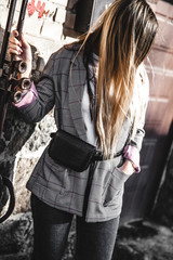 Fototapeta na wymiar Fashion young woman wearing black hat checkered coat jacket handbag