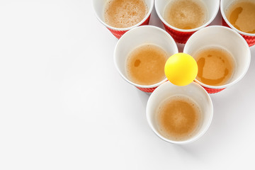 Obraz premium Cups and ball for beer pong on white background