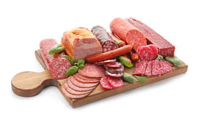 Assortment of delicious deli meats on wooden board, isolated on white