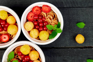 ..Healthy breakfast on white bowls.