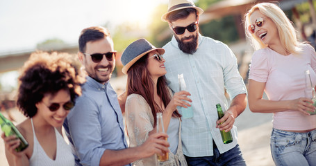 Happy friends having fun on beach