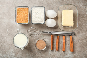 Ingredients for cooking cinnamon buns on table, top view