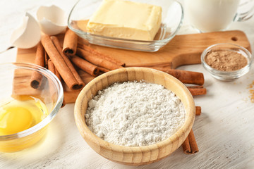Ingredients for cooking cinnamon buns on table