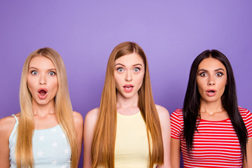 WTF! Portrait of shocked astonished trio with wide open mouth eyes and long hair looking at camera...