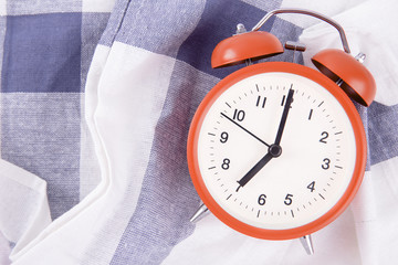 Alarm clock on bedroom interior morning time background