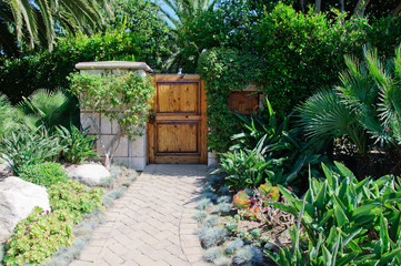 Fototapeta na wymiar House with green lawn manicured frontyard garden in suburban residential neighborhood