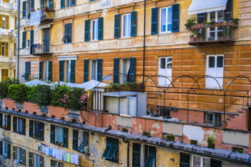 Fototapeta na wymiar Genoa, Italy - June, 12, 2018: wall of a residential building in Genoa, Italy