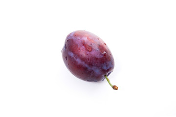 Ripe plum with water drops isolated on white background..