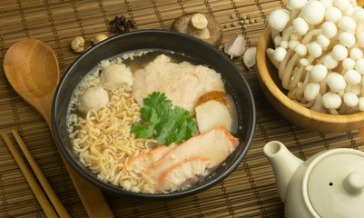 noodle pork and meat ball in a bowl