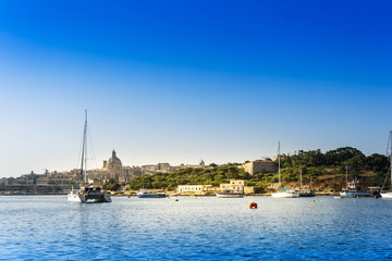 Fototapeta premium Mediterranean traditional colorful boats in Malta
