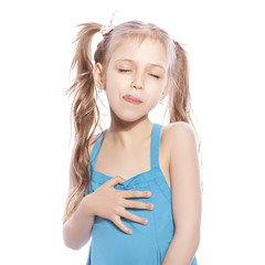 Young seven years old girl in blue dress on a white isolated background. Delightful, joyful...