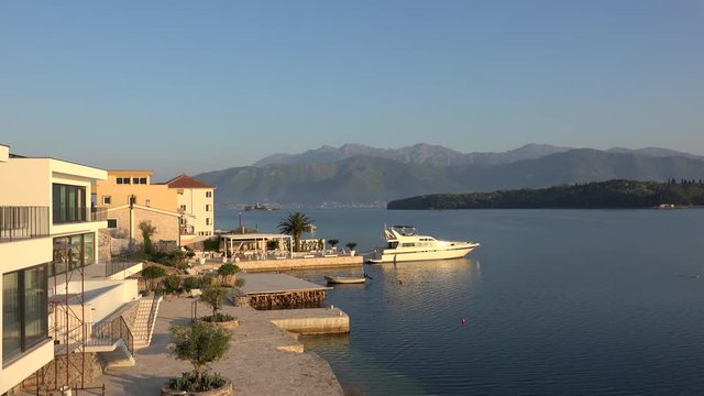 View of the Kotor Bay from the Obala Djurasevica coast at sunrise. Montenegro