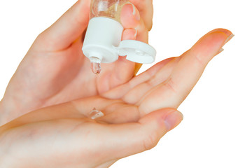 Human hands use a gel, disinfectant, antiseptic in a bubble, jar on a black background isolated closeup
