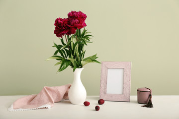 Composition with beautiful flowers on table