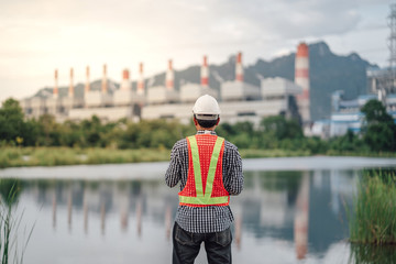 Asian male power plant engineer is working