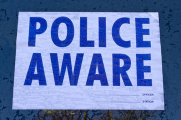 Police aware sign in blue & white UK
