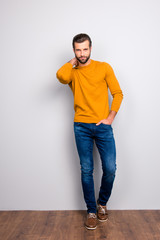 Full-length full-size portrait of handsome attractive sexy confident self-assured masculine virile bearded guy with modern hairstyle posing isolated on gray background