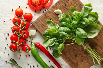 Fresh spices and vegetables on wooden table
